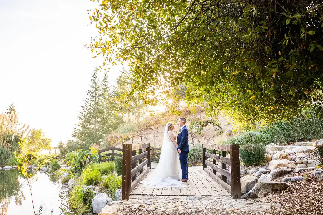 standing on the bridge at serendipity garden weddings standing on the bridge at serendipity garden weddings